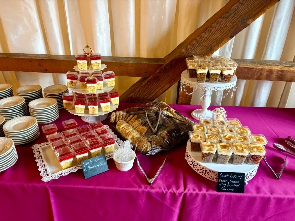 Cake shooters and cupcakes arranged on tiered stands
