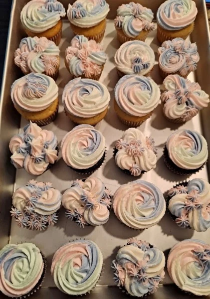 Cupcakes decorated with pastel buttercream flowers