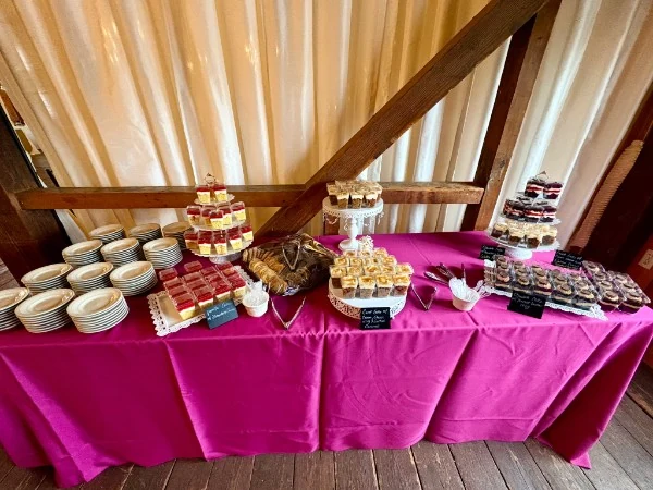 Dessert table with cake shooters and cupcakes